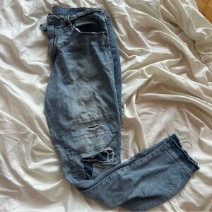 Blue Light Wash Relaxed Skinny Fit Jeans with Distressed Detailing